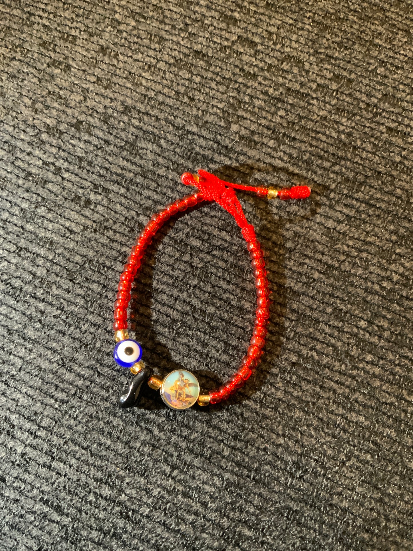 Adult thread bracelet with st michael, turkish eye, and black hand